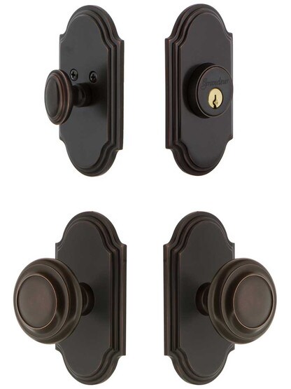 Grandeur Arc Entry Door Set, Keyed Alike with Circulair Knobs in Timeless Bronze.